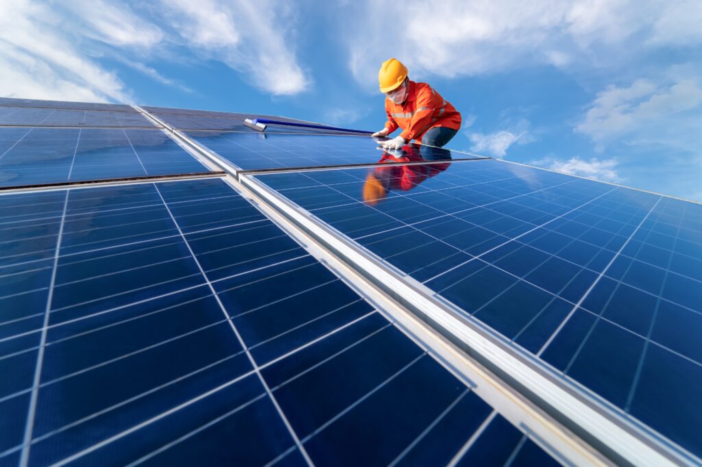 Man Is Working On Cleaning Solar Panels Repair Maintenance